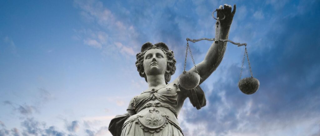 Law and Attorney Statue with Scale
