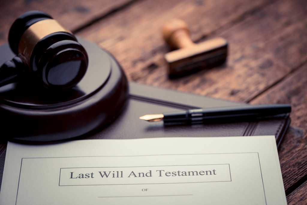 lose-up of a Last Will and Testament on a desk, symbolizing legal steps in estate administration.